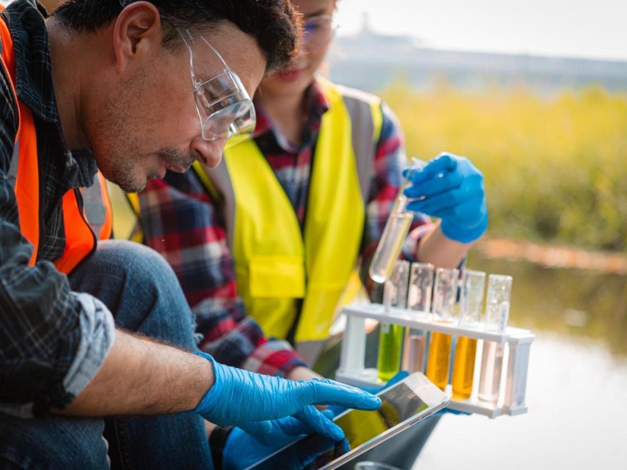 Field Workers Sampling Water